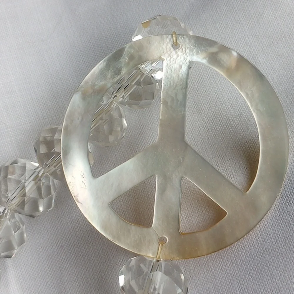 Large faceted Crystal beads w mother of pearl peace sign stretch bracelet